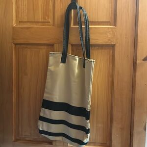 Long purse, possibly leather, new, cream colored with black